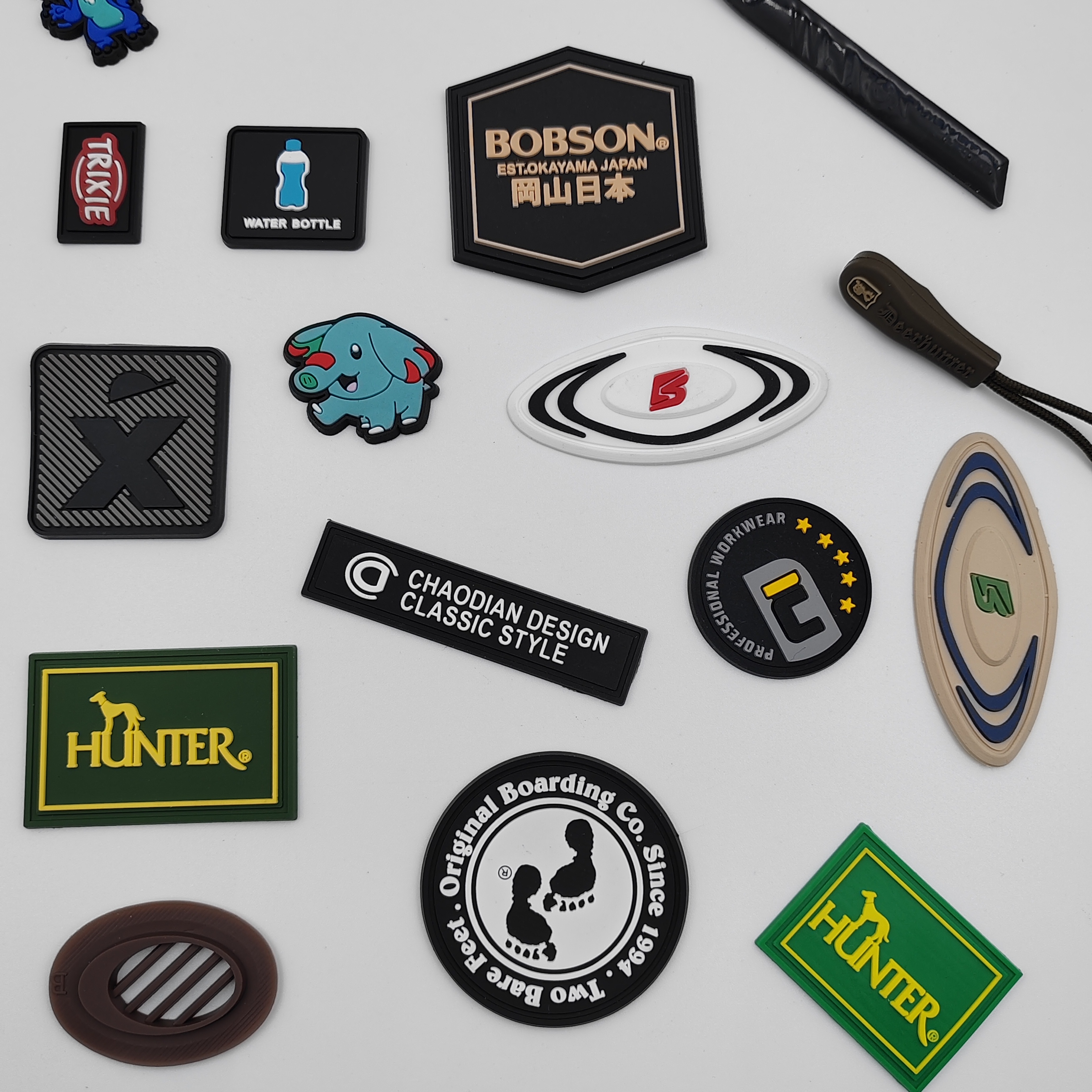 Customized Eco-friendly Soft PVC Embossed 3D Logo Silicone Patch For Clothing Shoes Garment Bags
